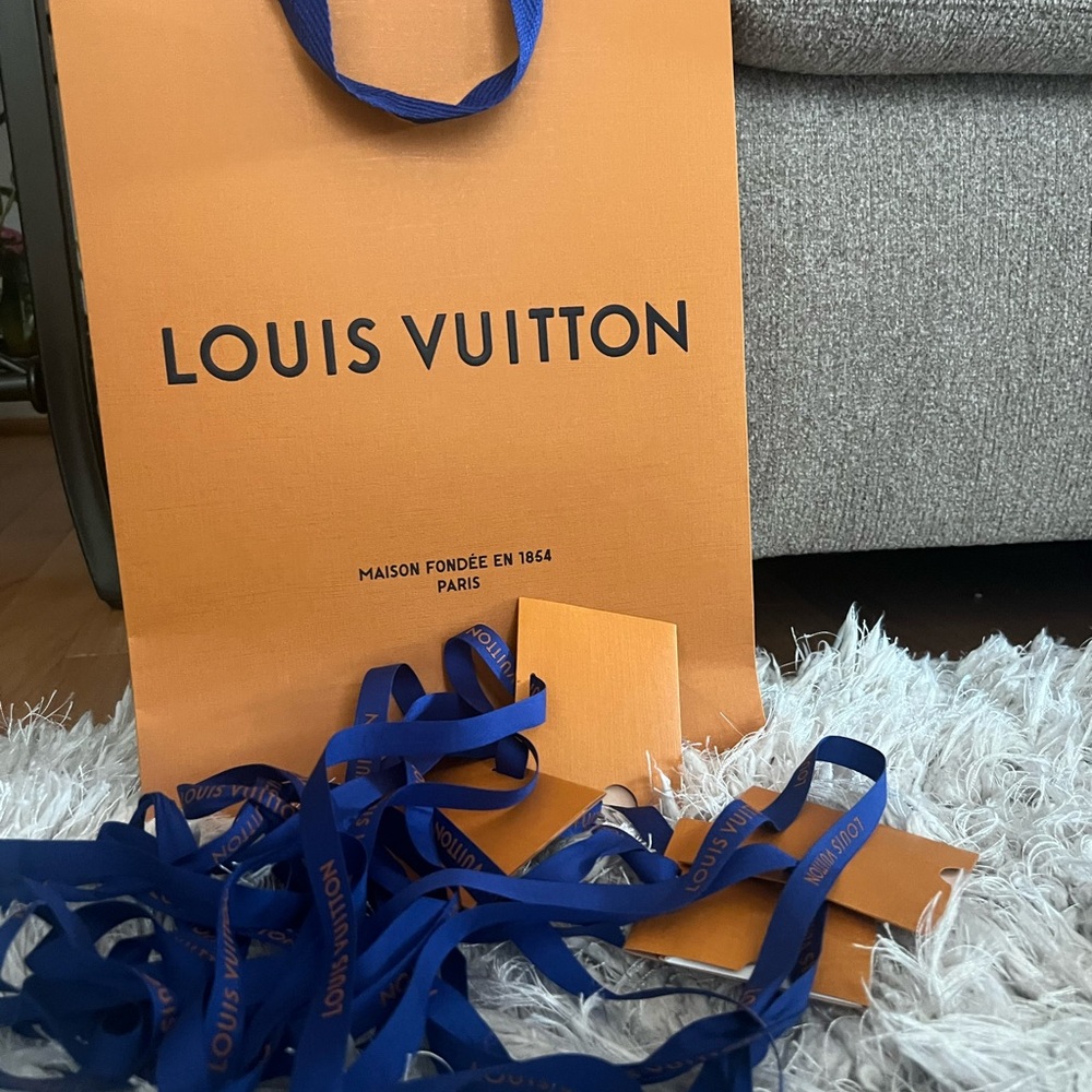 Louis Vuitton Vibrant Orange Bag with Deep Blue Ribbon